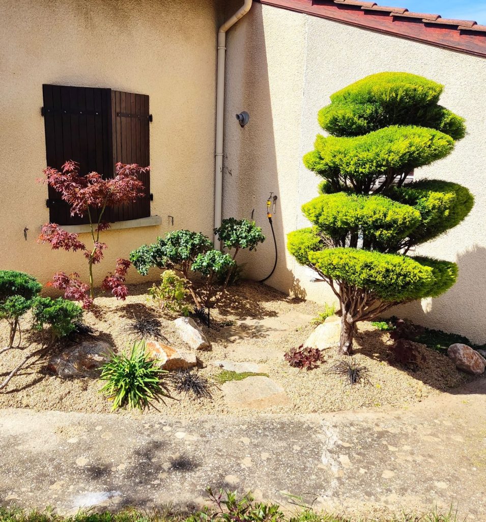 Jardin privé aménagé par Camps Paysage avec plantations variées et matériaux naturels